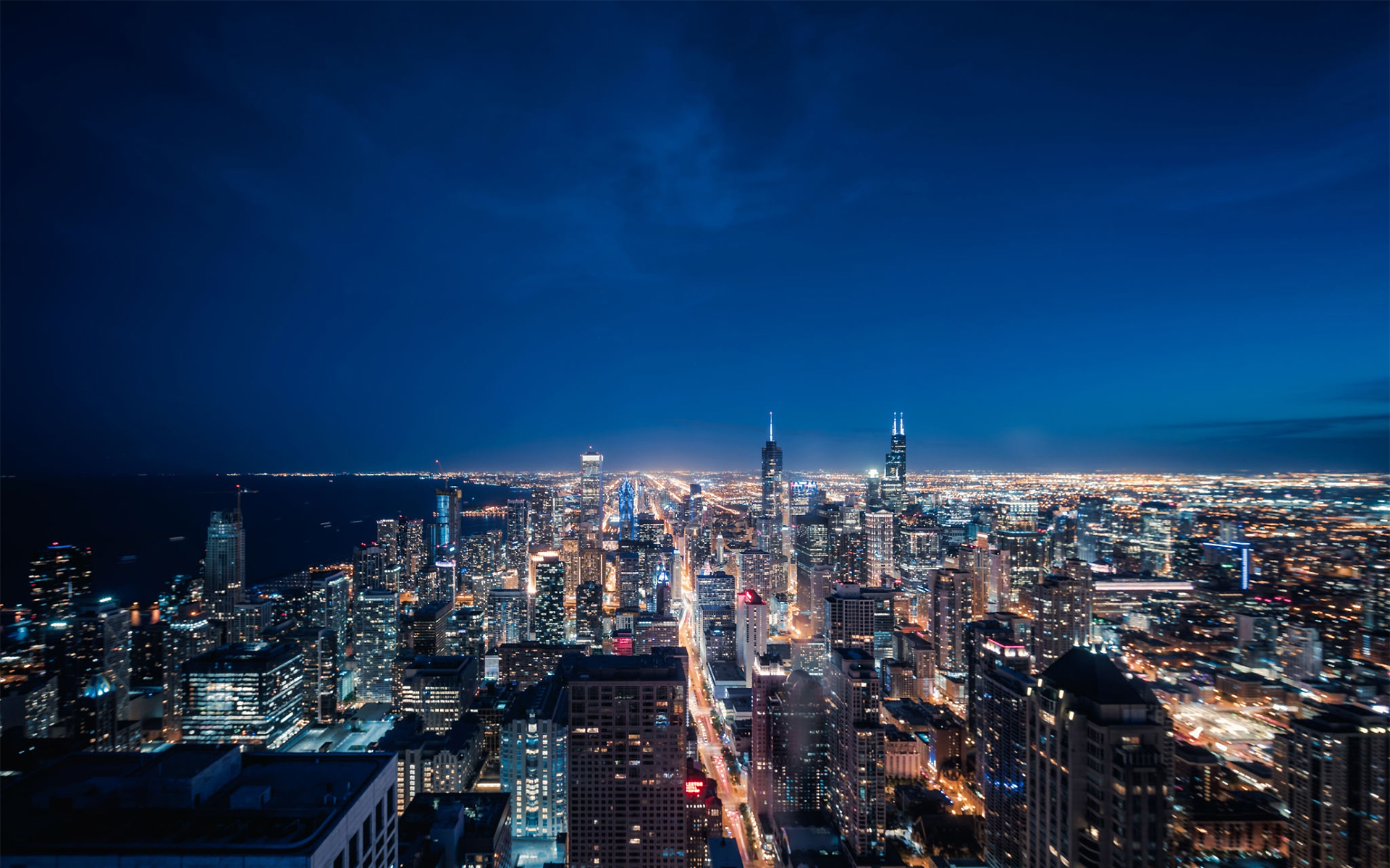 https://www.merekpedia.id/wp-content/uploads/2021/01/1160442138-Aerial-View-of-Chicago-cityscape-skyline-at-Night.jpg